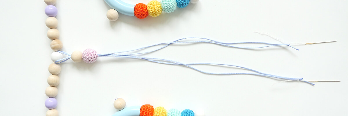 step-by-step instructions wooden bead rainbow garland: central garland element